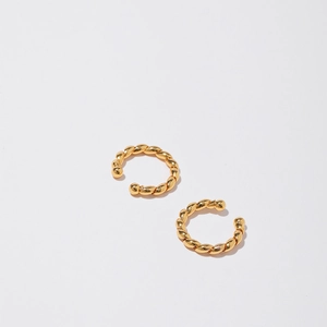 Detailed view of 18K gold plated twist rope ear cuffs with polished ball ends and C-shape