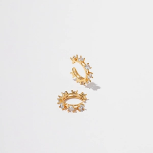 Macro shot of 18K gold-plated ear cuff with clear cubic zirconia stones in claw setting