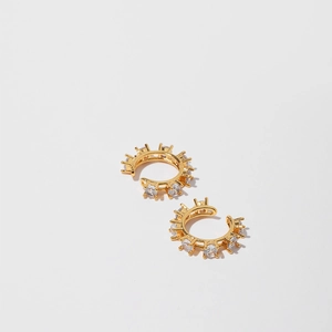 Detailed view of 18K gold plated non-pierced ear cuffs with inlaid zircon stones