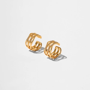 Macro detail of triple-layer 18K gold-plated ear cuff with pavé set cubic zirconia
