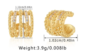 Detail view of 18K gold plated ear cuffs with cubic zirconia and beaded texture details