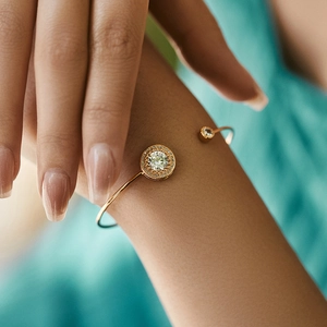 Detail of rose gold halo bracelet with shimmering zircon stones on a female wrist