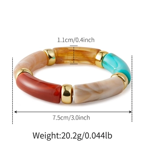 Macro view of marbled acrylic resin bracelet with golden metal spacers and 7.5cm diameter
