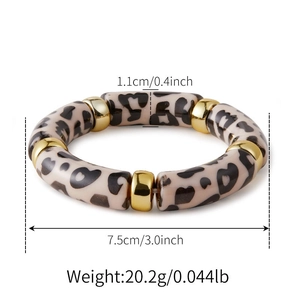 Size details of leopard print acrylic bracelet with gold spacers on white background