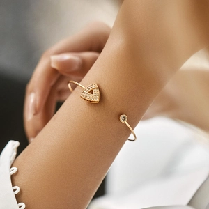Detail view of 18K gold plated brass cuff bracelet with leaf and zircon stones on wrist