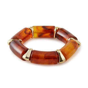 Amber tortoiseshell resin beaded bracelet with gold metal spacers on white background