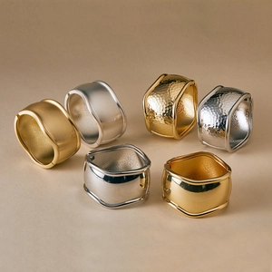 Retro irregular wide open bangle set in gold and silver with hammered and brushed texture