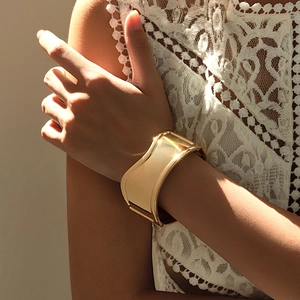 Exaggerated wide golden alloy cuff bracelet with irregular vintage wrinkled texture