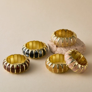Five-piece set of gold-framed elastic resin bracelets in various stylish textures