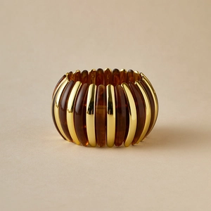Retro acrylic elastic cuff bracelet featuring gold metal bars and amber resin stripes