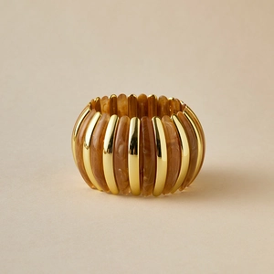Elastic wide bracelet with polished gold metal and amber tortoiseshell resin segments