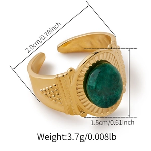 Detail of vintage gold open ring with green turquoise stone and pleated texture