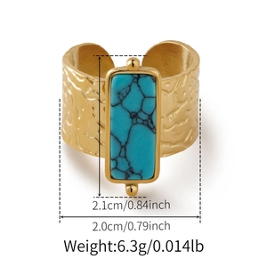 Detailed view of bohemian turquoise ring with hammered gold texture and size measurements