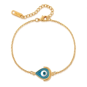 Detailed view of gold stainless steel bracelet with blue evil eye pendant and lobster clasp
