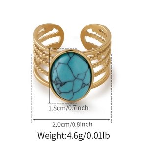 Detailed view of vintage gold ring with large oval turquoise stone and bead texture