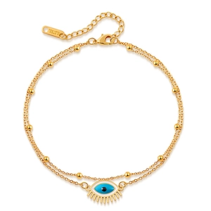 Detail of gold evil eye bracelet with double stainless steel chains and small beads