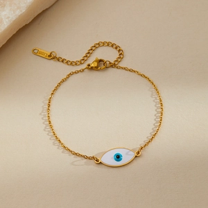 Detailed close-up of golden stainless steel Evil Eye bracelet with lobster clasp and chain