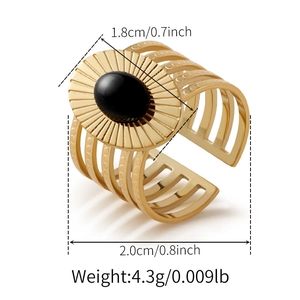 Close-up of golden wide ring with black stone and 1.8cm face height dimensions