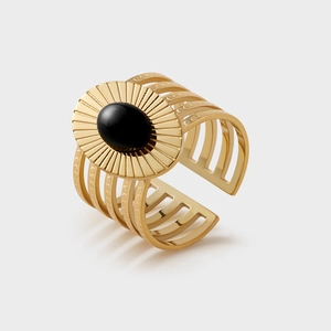 Detailed view of bohemian gold wide ring with black oval stone and five-layer hollow band