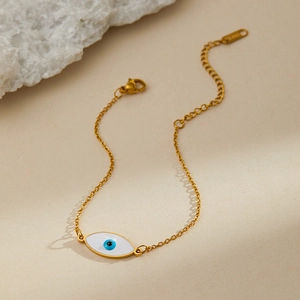 Detailed shot of golden stainless steel evil eye bracelet with adjustable chain