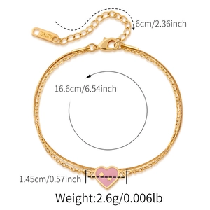 Detail showing dimensions of gold heart charm snake chain bracelet with pink enamel star