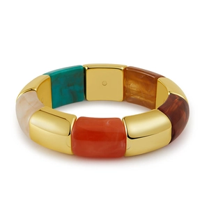 Detail of geometric bracelet with gold metal links and colorful marble resin blocks