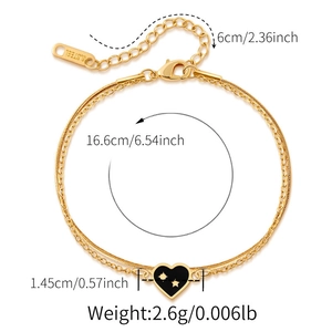 Detail of gold stainless steel dual chain bracelet with heart star pendant and size metrics