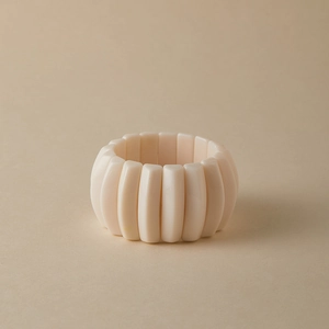 Detailed view of elastic handmade bracelet with pink acrylic marbled resin beads