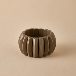 Detail view of segmented tortoiseshell resin bracelet with a matte vintage texture