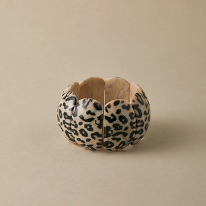 Detailed view of oval leopard print acrylic bracelet pieces with elastic stretch cord