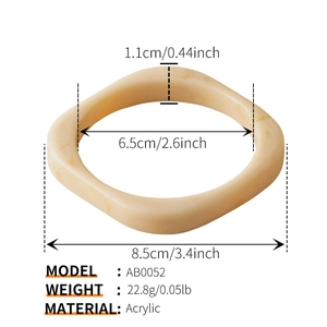 Detailed view of cream acrylic geometric bangle with marble texture and dimensions