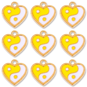 Set of nine heart-shaped yin yang pendants in yellow and white enamel for DIY jewelry