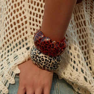 Fashionable leopard print chunky bangle set with textured red-brown and cream resin finish