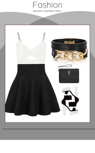 Détail d'une robe trapèze chic noire et blanche avec encolure licou croisée et accessoires
