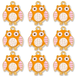 Set of nine cute owl charms in gold alloy with orange enamel and colorful wing detail