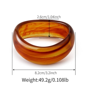 Detail view of amber resin cuff with dimensions 8.2cm diameter and 2.6cm width