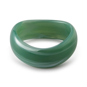 Close-up of wide wavy emerald green acrylic bangle with marbled white veins texture