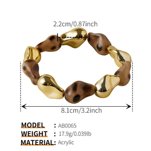 Detailed view of leopard print acrylic beads and gold-toned geometric spacers on bracelet
