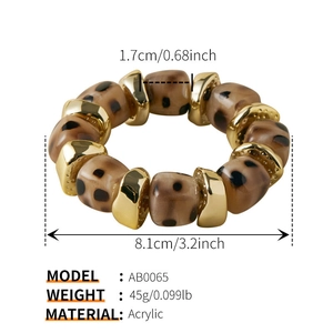 Detail showing acrylic leopard print beads with gold spacers on elastic bracelet cord
