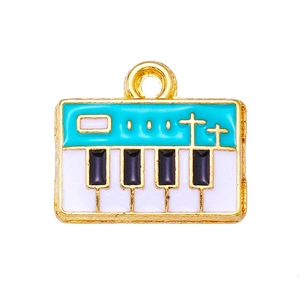 Detailed macro view of piano key enamel charm with blue and gold alloy finish
