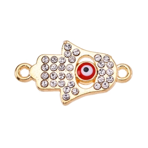 Macro detail of Hamsa Hand connector with white rhinestones and red evil eye charm