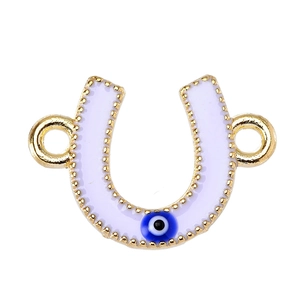 Macro detail of lavender enamel horseshoe charm with blue evil eye bead and golden finish
