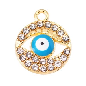 Macro shot of evil eye pendant with crystal rhinestones and blue enamel inlay finish