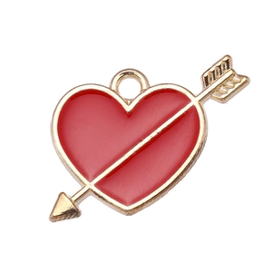 Detailed view of red enamel heart pendant with golden arrow for DIY jewelry crafting
