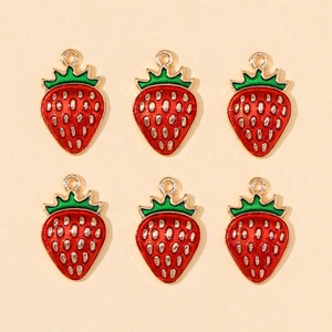 Detailed view of six red strawberry alloy charms with green leaves for DIY jewelry