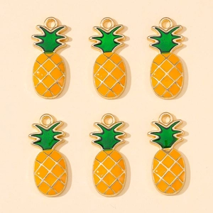 Detailed view of six yellow enamel pineapple charms with green leaves and gold borders