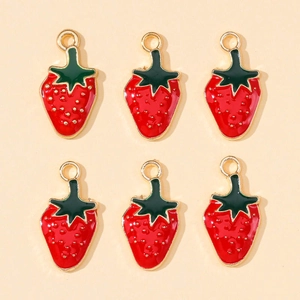 Macro detail of six enamel strawberry charms for DIY jewelry making and fruit earrings