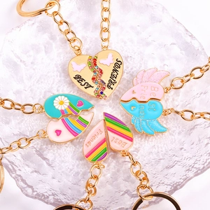 Matching Best Friends heart keychains in four colorful enamel and gold metal designs