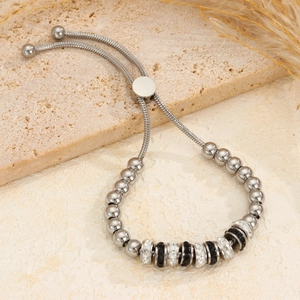 Verstelbare roestvrijstalen kralenarmband met zwart-witte diamantgezette ringaccenten