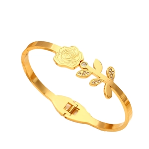 Polished 18k gold plated rose flower bangle with rhinestone leaves on white background